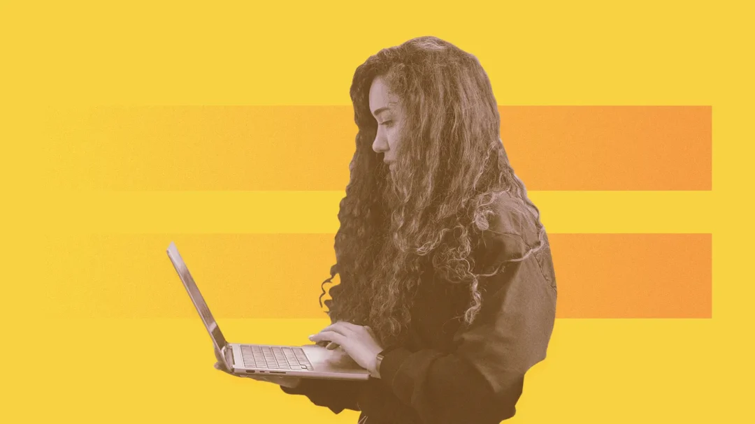 An illustration of a specialist with long curly hair working on a laptop, set against a vibrant yellow and orange background.