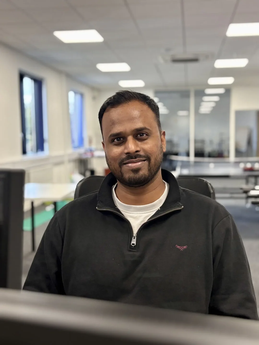 A professional portrait of a Meta ads specialist at the Repeat Digital office in Nottingham, representing expert campaign management.