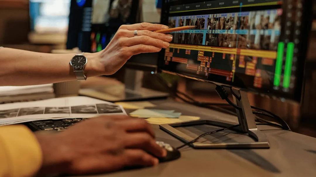 A close-up of a digital specialist editing a video project timeline to optimise performance-driven video ads for a SaaS client.