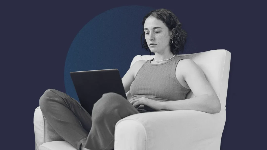 A person using a laptop in a comfortable armchair, representing the seamless online shopping experience and increased sales driven by Repeat Digital's SEO strategy