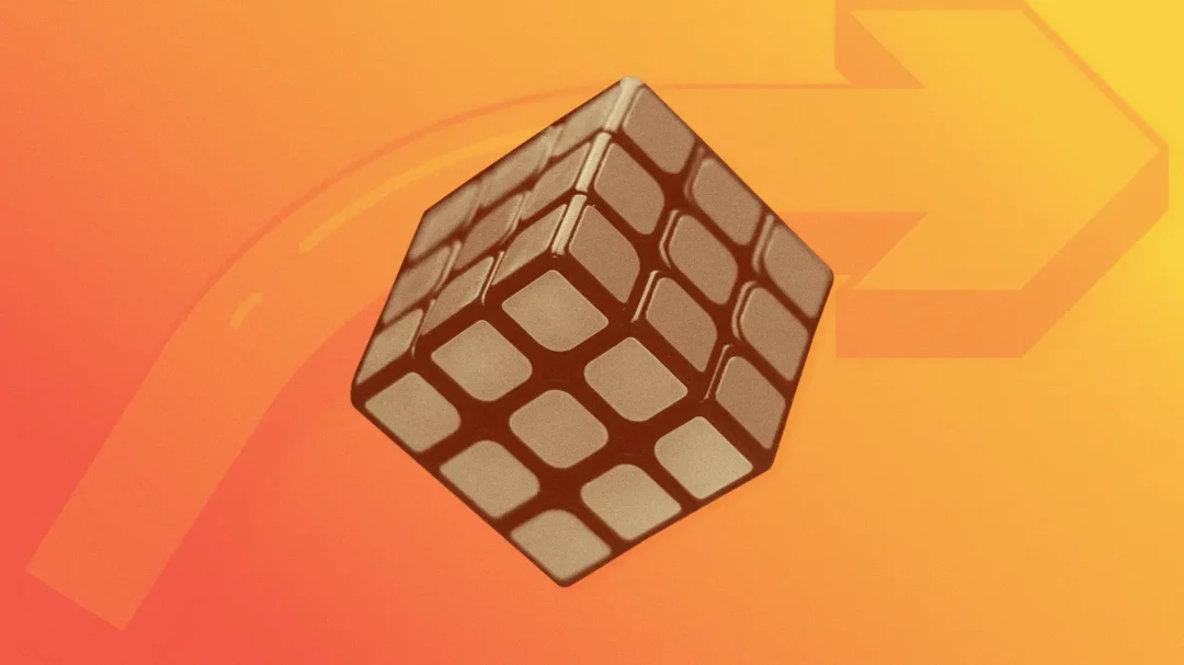 A Rubik's Cube illustration against an orange gradient background, representing the strategic problem-solving and discovery phase of an SEO campaign.